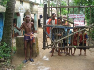 Villagers block entry to Dhinkia village on the Posco site