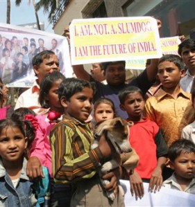 Success and Protest - slum children protest at the film's title - pic from huffingtonpost.com