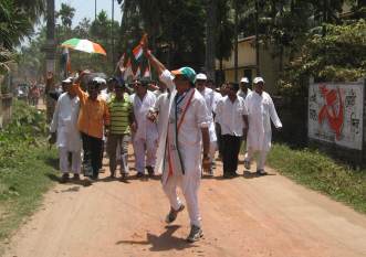 Dinish Trivedi - and a CPI(M) wall painting