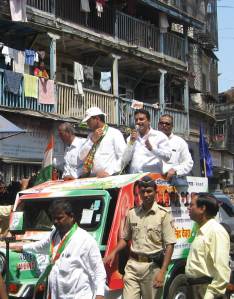 Milind Deora (centre with cap)