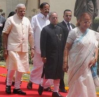 Prime minister Narendra Modi (left) and President Pranab Mukherjee (centre) walk to parliament today 