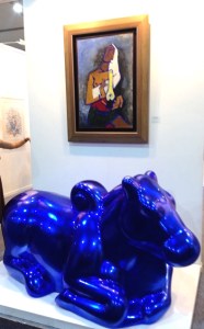 paint-silverleaf fibreglass bull by Arunkumar HG below an M.F.Husain - Crayon Gallery 