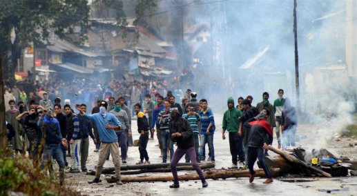 Protesters throw stones at police during clashes - PTI Photo