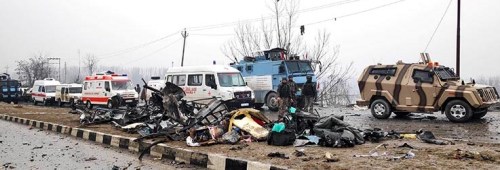 Indian soldiers examine the debris after an explosion in Lethpora in south Kashmir's Pulwama district